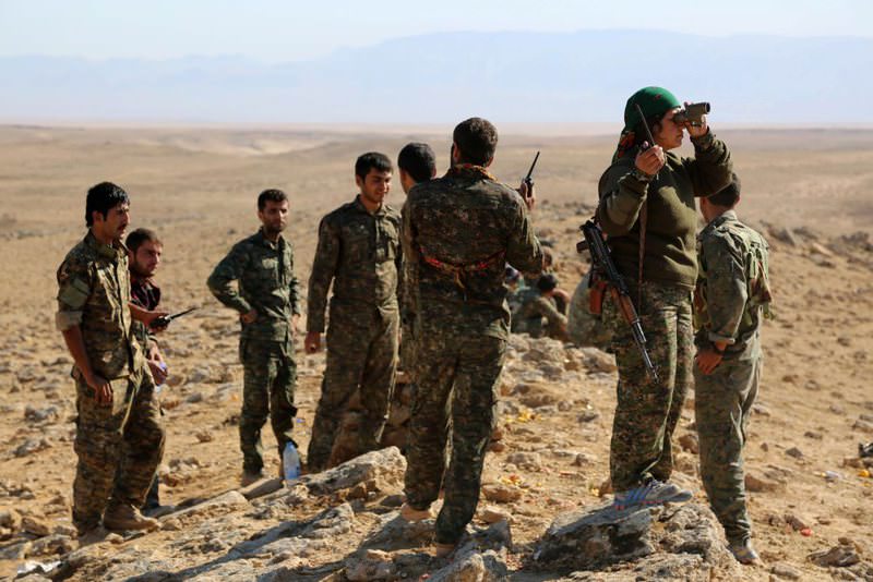 A group of YPG militants monitoring the area in al-Hol in Syria's Hasakah province last year.
