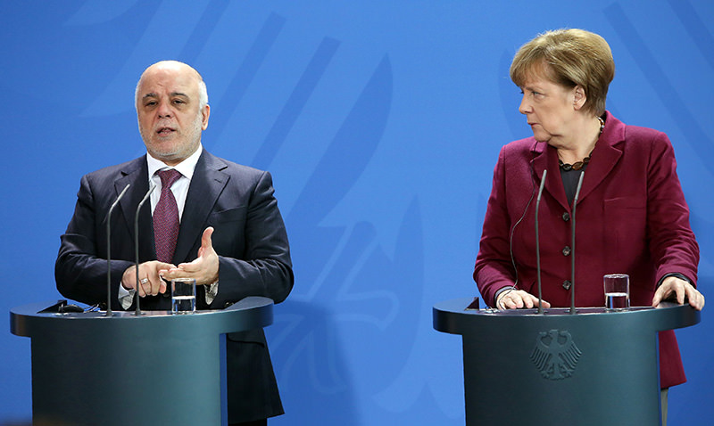 German Chancellor Angela Merkel (R), Iraqi PM Haider al-Abadi in a joint press conference at Chancellery in Berlin on Feb 11, 2016. (AFP)