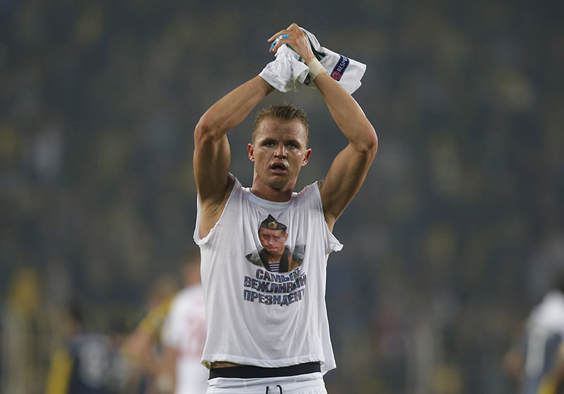 Locomotiv Moscow's Dmitri Tarasov features an inner shirt with a picture of Russian President Vladimir Putin and the slogan ,The most polite President,. (AP Photo)