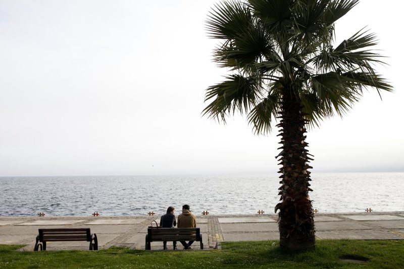 A man and a woman sit on a bench on the shore of Sinop, Turkey's northernmost city, where the ,happiest people, or individuals most satisfied with life live, according to a 2013 survey.