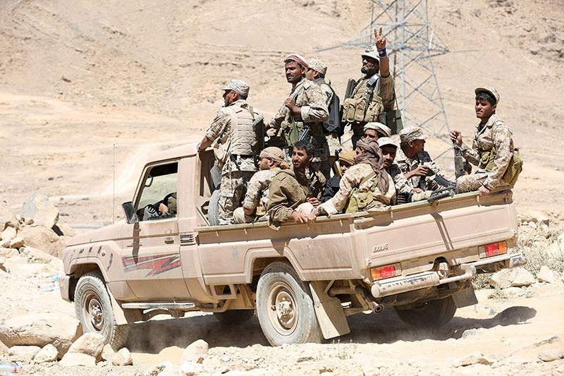 Pro-government army soldiers ride on the back or a truck in Fardhat Nahm area, February 20, 2016. (Reuters Photo)