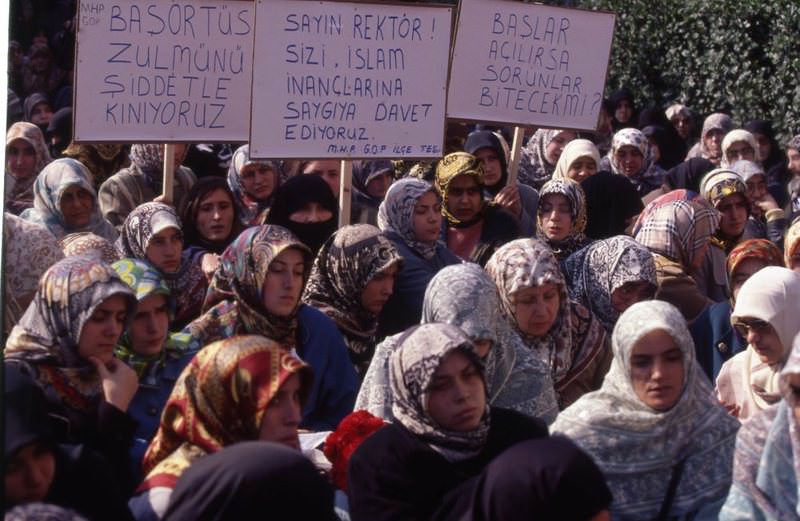 Headscarf-wearing women stage a protest against the headscarf ban in front of Istanbul University in 1997.