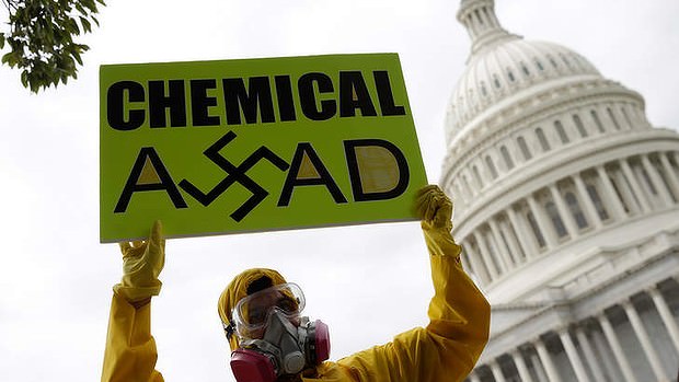Syrian American protesters outside the US Capitol urging Congress to support President Obama in striking Syria for using chemical weapons against its own people. (AFP Photo)