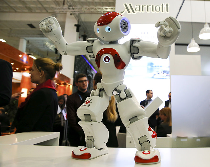 A Zora Bots humanoid robot called 'Mario', which is used in the workflow of the Ghent Marriott Hotel in Belgium, dances at the Marriott exhibition stand on the International Tourism Trade Fair (ITB) in Berlin (Reuters Photo)