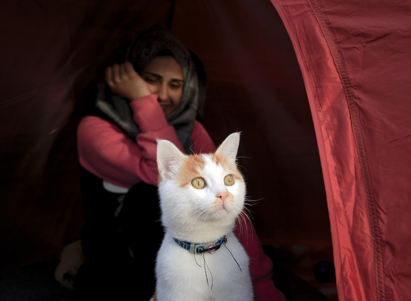 Abeed, her husband and daughter are stuck with about 14,000 others at the Greece-Macedonia border, where sharp stones poke up through the thin bottom of a small tent donated by the Red Cross that is their temporary home.