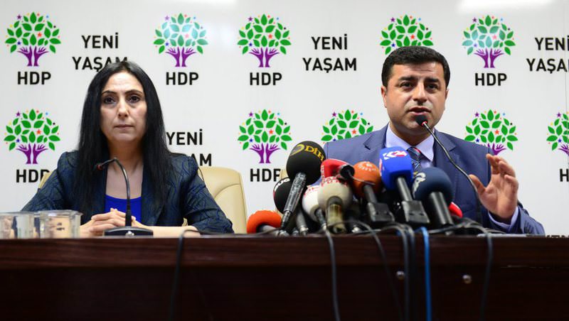 HDP Co-Chairs Yu00fcksekdau011f (L) and Demirtau015f at a press conference. The two deputies could face lawsuits if Parliament lifts their immunities on March 22.