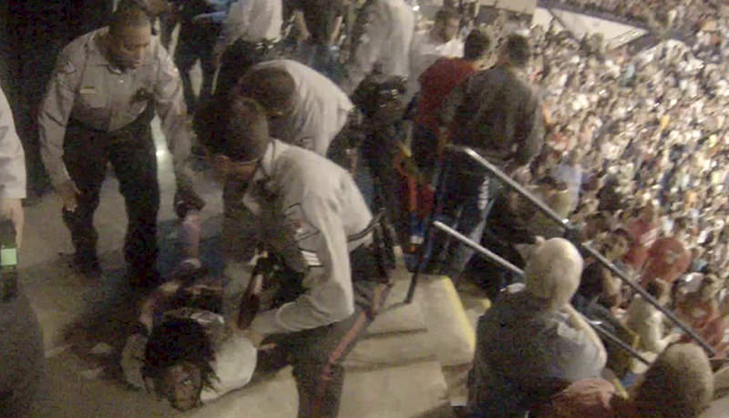 Rakeem Jones lies on the ground while being removed by deputies from a Donald Trump rally in Fayetteville, North Carolina March 9, 2016, in a still image from video provided by Ronnie Rouse March 10, 2016 (Reuters Photo)