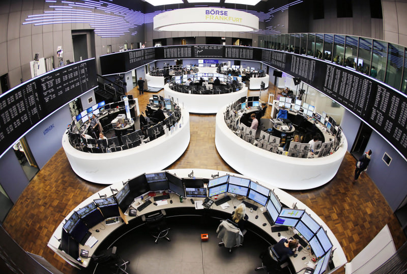Brokers work in the trading room of the stock market in Frankfurt, Germany, Wednesday, March 16, 2016. Deutsche Boerse and London stock exchange plan to merge.