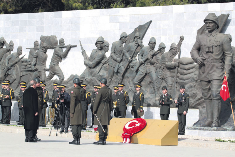 Erdou011fan, accompanied by honor guards, lays a wreath at a monument for the u00c7anakkale dead. Thousands of Ottoman troops died in 1915 in an area near the monument. (IHA Photo)
