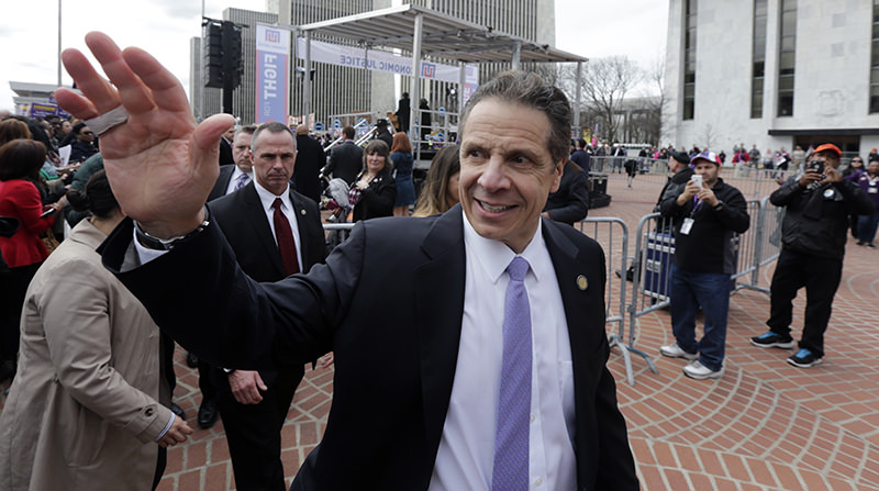 In this Tuesday, March 15, 2016 photo, New York Gov. Andrew Cuomo leaves a minimum wage rally at the Empire State Plaza in Albany, N.Y (AP Photo)