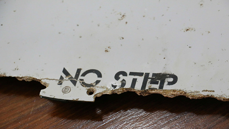 his file photo taken on March 3, 2016 shows a piece of suspected aircraft wreckage found off the east African coast of Mozambique at Mozambique's Civil Aviation Institute (IACM) in Maputo. (AFP Photo)