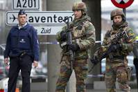 Belgian troops and police controlling a road leading to Zaventem Airport following Tuesday's airport bombings in Brussels.