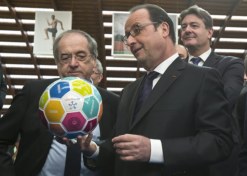 Head of French Football Federation (FFF) Noel Le Graet (L) stands next to French President Francois Hollande (AP Photo)