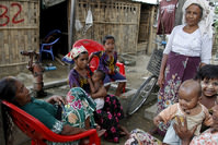  Family members of Rohingya gather in front of their hut at an Internally Displace Persons (IDPs) camp near Sittwe of Rakhine State, western Myanmar, 22 March 2016. (EPA Photo)