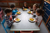 This file photo taken on December 11, 2015 shows children eating lunch in their kindergarten at Hrebendova street in the Lunik IX borough of Kosice. (AFP Photo)
