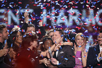 Trent Harmon, center, winner of ,American Idol, The Farewell Season celebrates with fellow contestants during the season finale at the Dolby Theatre on Thursday, April 7, 2016, in Los Angeles. (AP Photo)