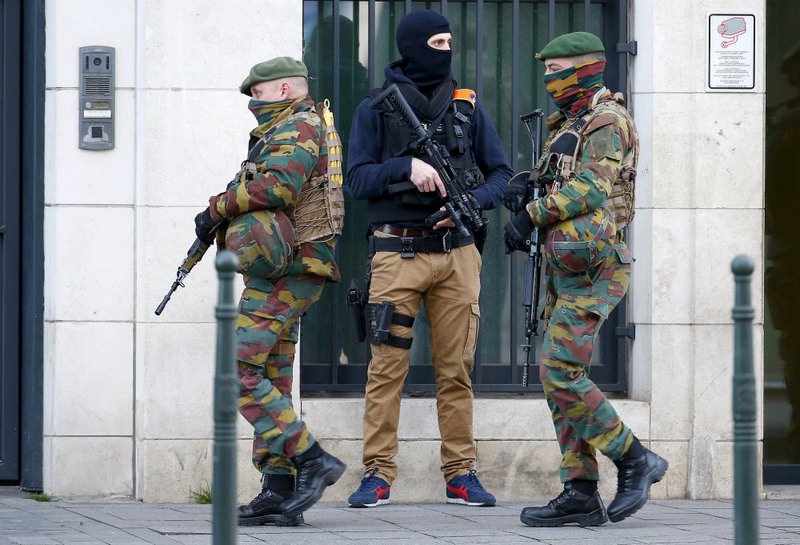 Belgian soldiers and special forces police keep guard outside a courthouse as Paris attacks suspect Salah Abdelslam remains in police custody in Brussels, Belgium on April 7.