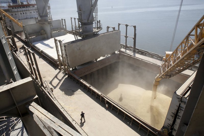 A dockyard worker watches as barley is mechanically poured into a 40,000 ton ship at a Ukrainian agricultural exporter's shipment terminal in the Black Sea port of Nikolayev, now known as Mykolaiv, Ukraine.