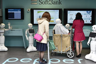 Young women visit a newly opened robot-staffed store in Tokyo, Japan, 24 March 2016 (EPA Photo)
