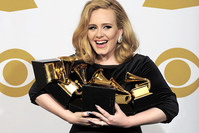Adele poses backstage with her six awards at the 54th annual Grammy Awards on Sunday, Feb. 12, 2012 in Los Angeles, USA (AP Photo)