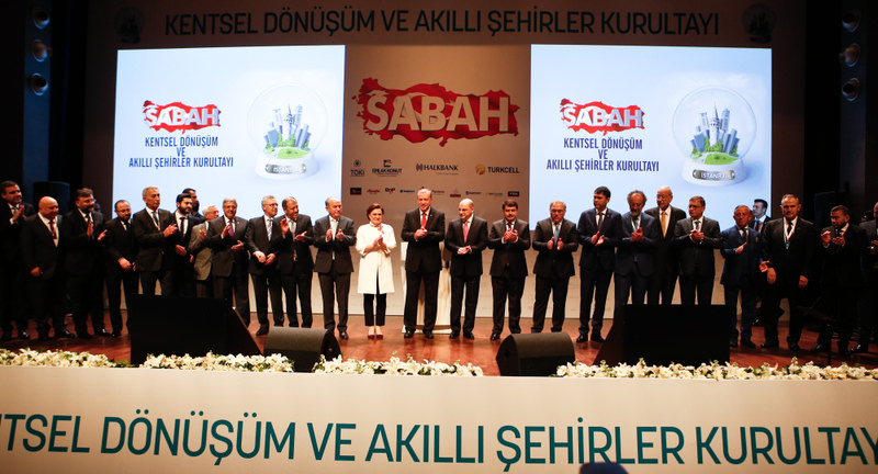 President Recep Tayyip Erdou011fan (C) and CEOs of Turkey's leading construction companies standing for a family photo at the Urban Development and Smart Cities Assembly organized by the Sabah daily.