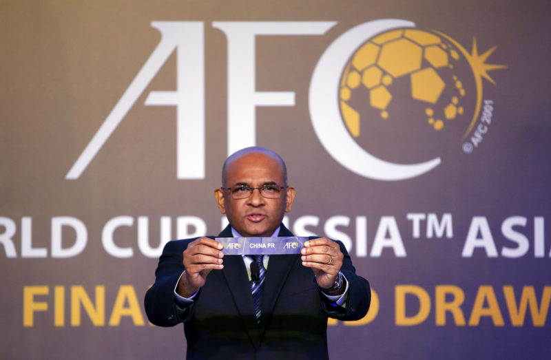 Asian Football Confederation General Secretary Windsor John holds the country name card of China in the draw for 2018 FIFA World Cup Russia Asian qualifiers final round in Kuala Lumpur.