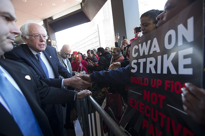Democratic presidential candidate, Sen. Bernie Sanders, I-Vt., greets a CWA worker at a Verizon workers picket line, Wednesday, April 13, 2016. (AP Photo)