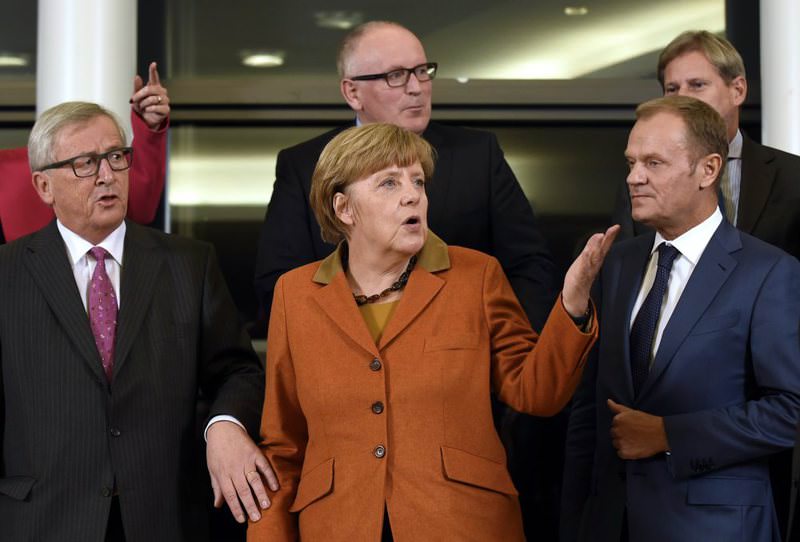 German Chanellor Merkel (C) with EU Commission President Juncker (L), European Council President Tusk (R) and European Commission Vice President Timmermans (Back-C) (AFP Photo).