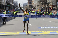 Atsede Baysa, of Ethiopia, crosses the finish line to win the women's division of the 120th Boston Marathon on Monday, April 18, 2016. (AP Photo)