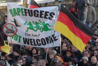 Supporters of far-right groups at in a protest against refugees and Islam.