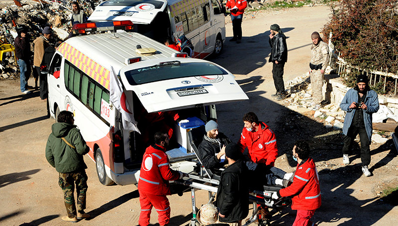In this file photo released on December 28, 2015, Syrian Red Crescent workers carry a wounded Syrian opposition fighter, during an evacuation from the town of Zabadani, in Syria (AP Photo)