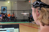 In this April 16, 2016 photo. a University of Florida student uses a brain-controlled interface headset to fly a drone during a mind-controlled drone race in Gainesville, Fla. (AP Photo)