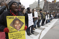 In this Nov. 25, 2014, file photo, demonstrators block Public Square in Cleveland, during a protest over the police shooting of Tamir Rice. (AP Photo)