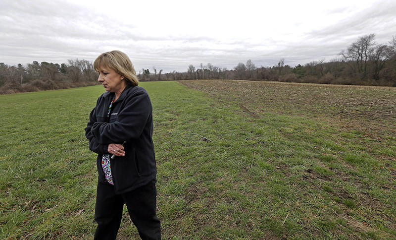 In this April 12, 2016 photo, Desiree Moninski, walks on land located across from her house in Dudley, Mass., which is the site of a proposed Muslim cemetery (AP Photo)