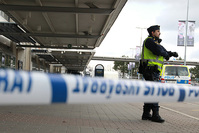 A police officer guards the cornered off domestic flight terminal at the Landvetter airport near Gothenburg, Sweden March 31, 2016 (Reuters Photo)