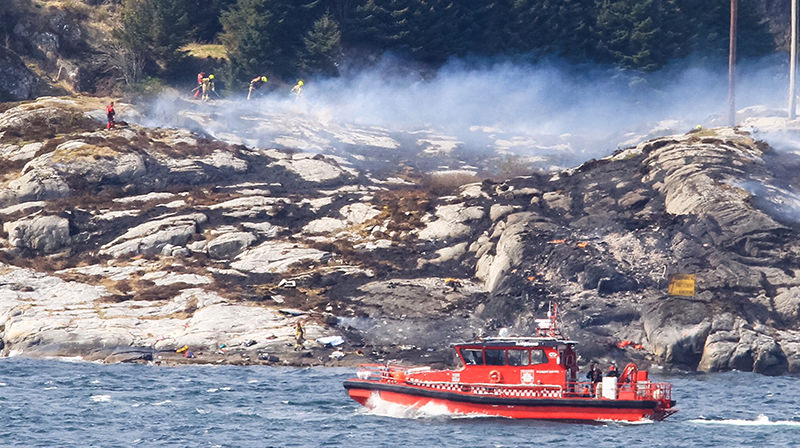 A search and rescue vessel patrols off the island of Turoey, near Bergen, Norway, as emergency workers attend the scene of a helicopter crash believed to have 13 people aboard, Friday April 29, 2016 (AP Photo)