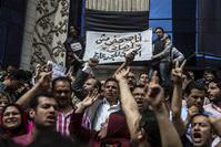 Journalists hold a banner in Arabic that reads: ,I am a journalist not a terrorist,, during a demonstration outside the Journalist Syndicate headquarters in Cairo.