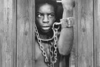 A scene from the 1977 mini-series ,Roots, which is an adaptation of Haley's namesake novel.