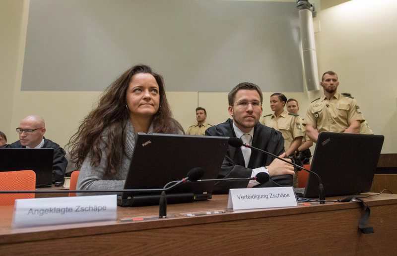 Beate Zschaepe (L) seated during the NSU trial in Munich on May 10. Zschaepe is accused of being a member of the neo-Nazi gang implicated in 10 murders between 2000 and 2007. (EPA Photo)