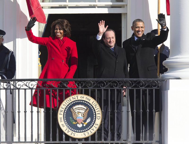 U.S. President Barack Obama (R), first lady Michelle Obama (L) and French President Franu00e7ois Hollande (C). The U.S. and France have two different forms of effective presidential systems. (AP Photo)