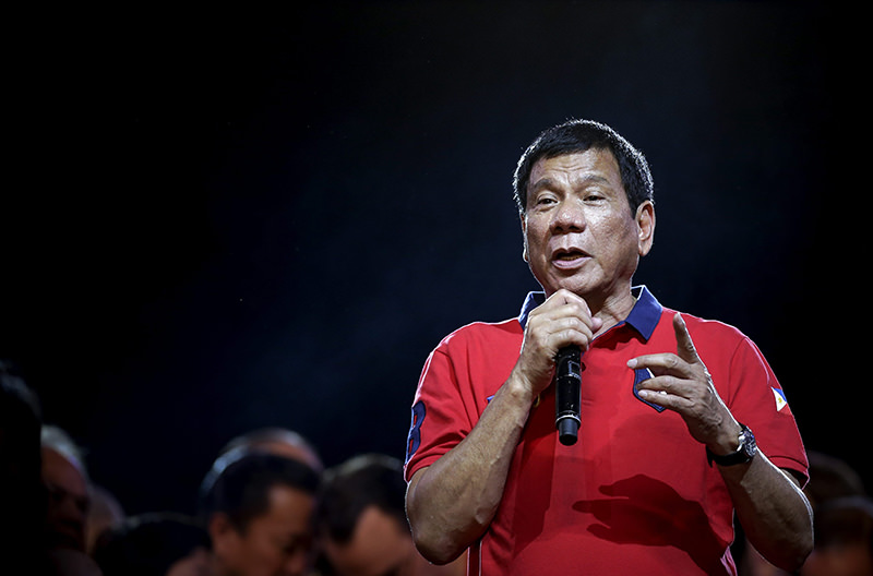 A picture made available on 12 May 2016 shows Philippine President-elect Rodrigo Duterte speaking to supporters during a rally in Manila, Philippines. (EPA Photo)