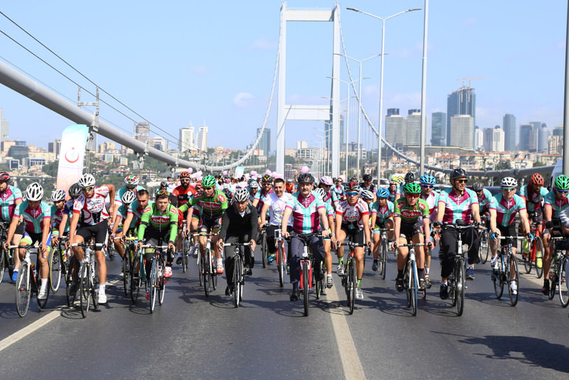 Cyclists ride over the 1.6 kilometer long Bosporus Bridge, the last stopover of their ride that took them from Austria to Turkey.