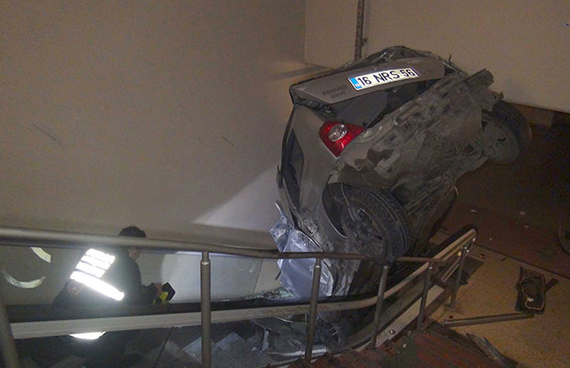 Car lands on metro escalator after accident in Bursa. (DHA Photo)