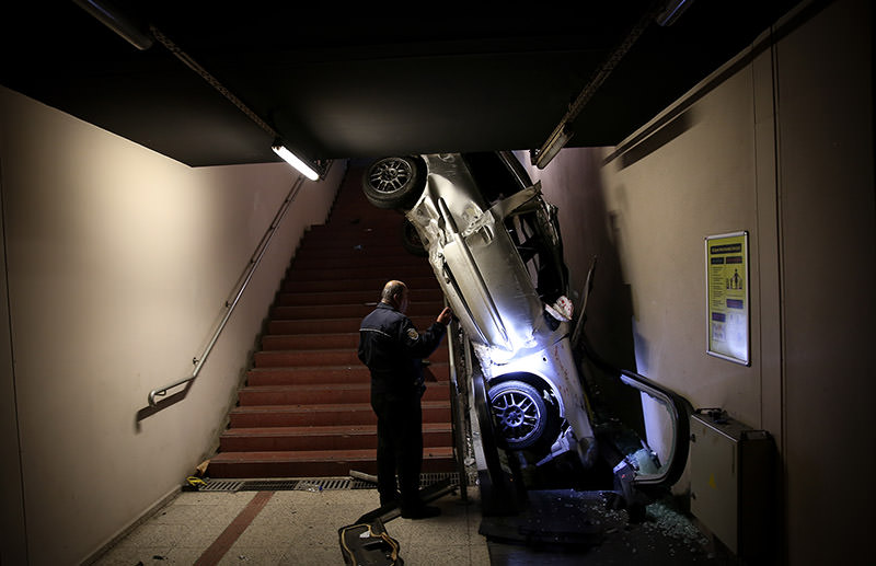 Car lands on metro escalators after accident in Bursa. (AA Photo)