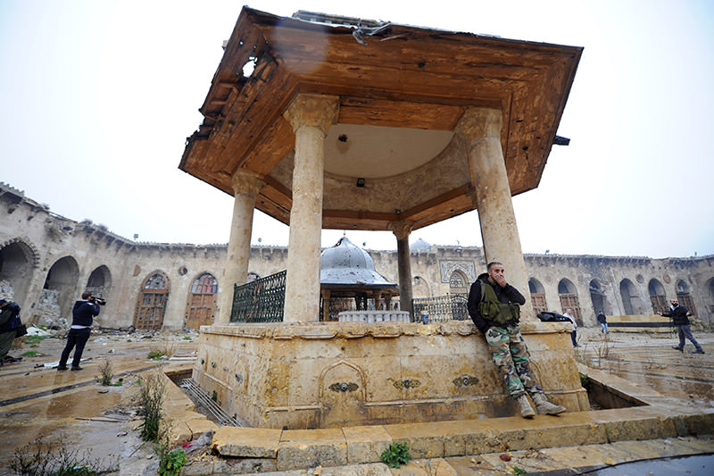 Forces loyal to Assad regime stand inside the Umayyad mosque, in the government-controlled area of Aleppo, during a media tour on Dec. 13, 2016. (Reuters Photo)