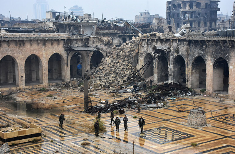 A general view shows Assad regime forces walking in the ancient Umayyad mosque in the old city of Aleppo on Dec. 13, 2016. (AFP Photo)