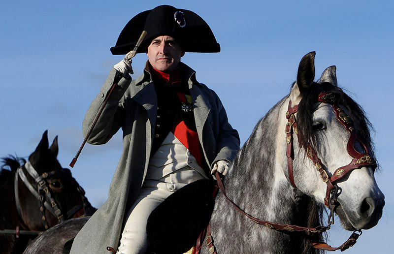 An actor, dressed as French Emperor Napoleon I, rides his horse before the re-enactment of Napoleon's famous battle of Austerlitz. (Reuters Photo)