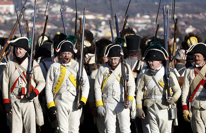 History enthusiasts dressed in regimental costumes take part in a re-enactment of the battle of Austerlitz. (AP Photo)