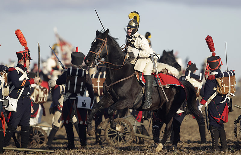 History enthusiasts dressed in regimental costumes take part in a re-enactment of the battle of Austerlitz. (AP Photo)