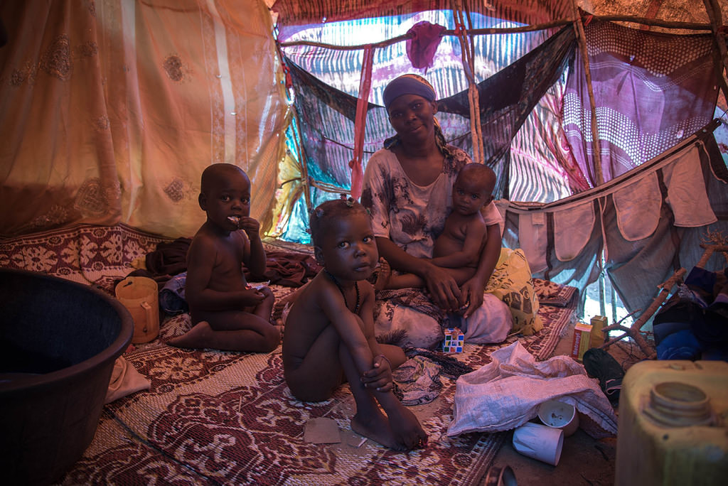 Amina Sharif Muhammad, who lost her husband on the way to Mogadishu, struggles to survive with her four children in a tent camp.